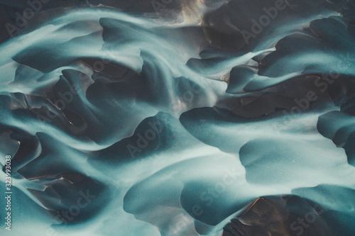 Blue glacier river in Iceland from an aerial perspective