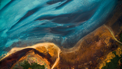 Alu-Dibond Bilder Motivwelten Aerial view from above on a green and blue glacier river stream in  South Iceland. Beautiful patterns, textures and structures. Melting glacier,  Global warming and climate change concept  © eVEN