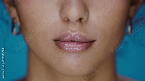 close-up of woman lovely smile with perfect white teeth and camera movement