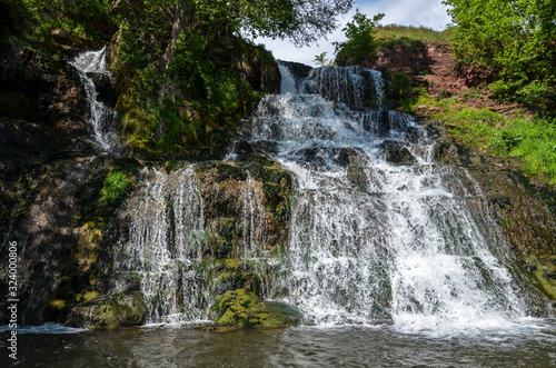 Dzhurynskyi or the Chervonohorodskyi waterfall. It is the largest in Ukraine plain waterfall. Spring landscape. Local natural landmark. Nyrkiv, Ternopil region, Ukraine