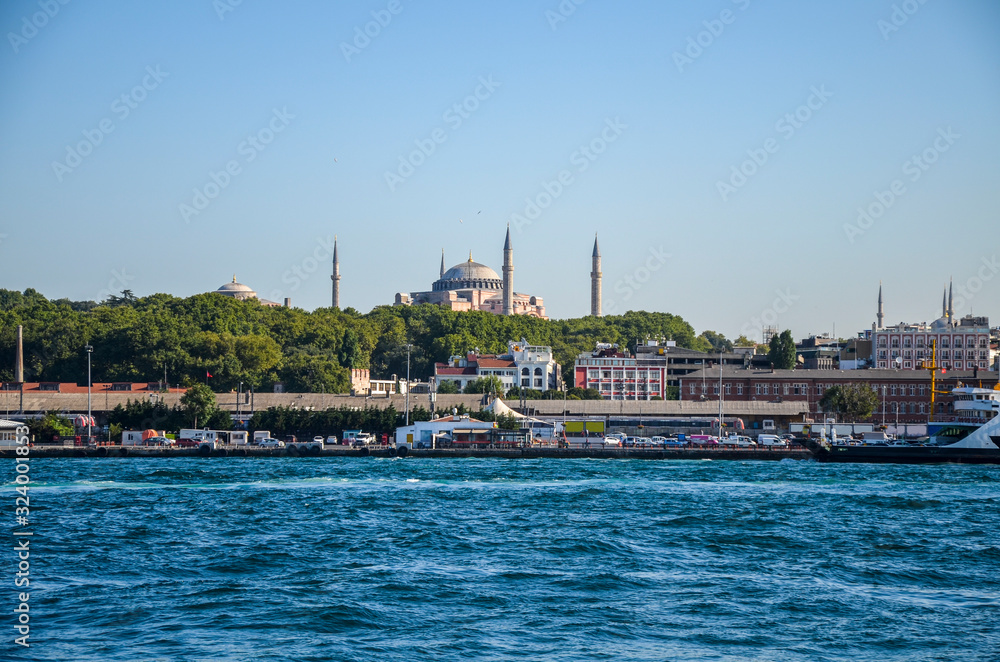 View of the city from the Bosphorus to the mosque of Hagia Sofia in Istanbul, Turkey. Tourist city landscape