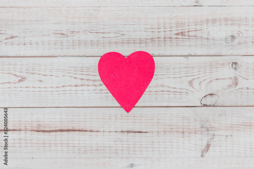 minimalist flat lay composition with red paper heart on white wooden background, concept of love for wedding or valentines day with copy space minimalist flat lay composition with red paper heart on white wooden background, concept of love for wedding or valentines day with copy space