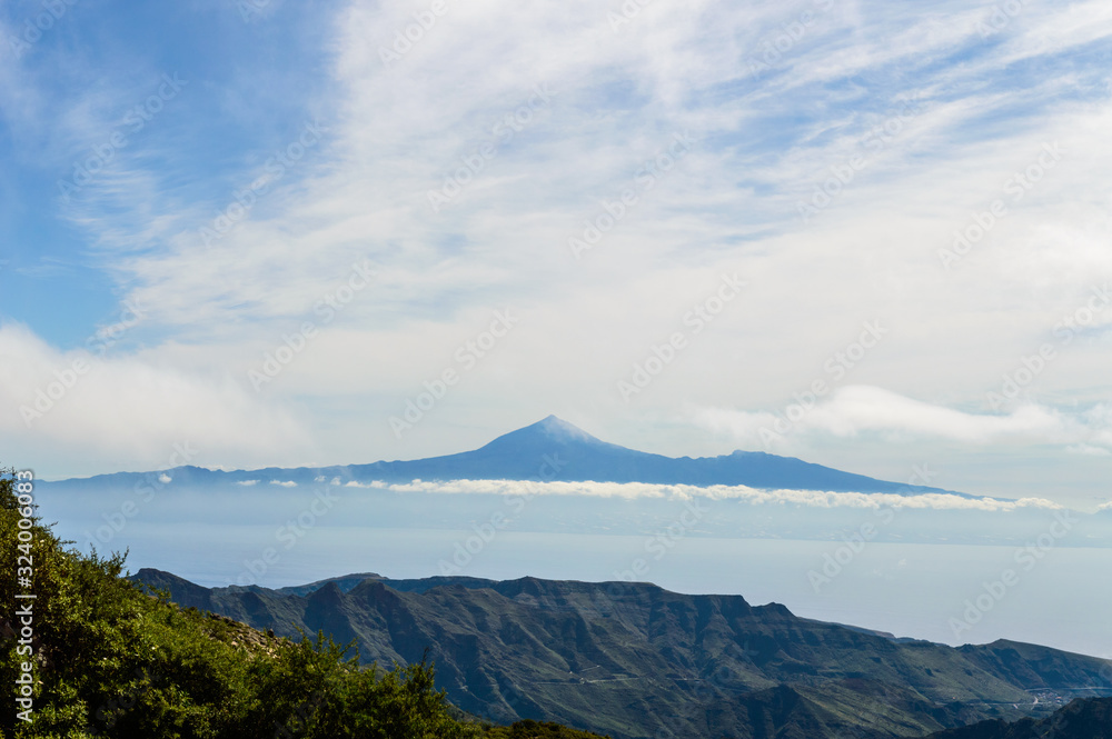 Views of the island of Tenerife and the Teide from the viewpoint of the Laja in the haze of the summits in La Gomera. April 15, 2019. La Gomera, Santa Cruz De Tenerife Spain Africa. Travel Tourism