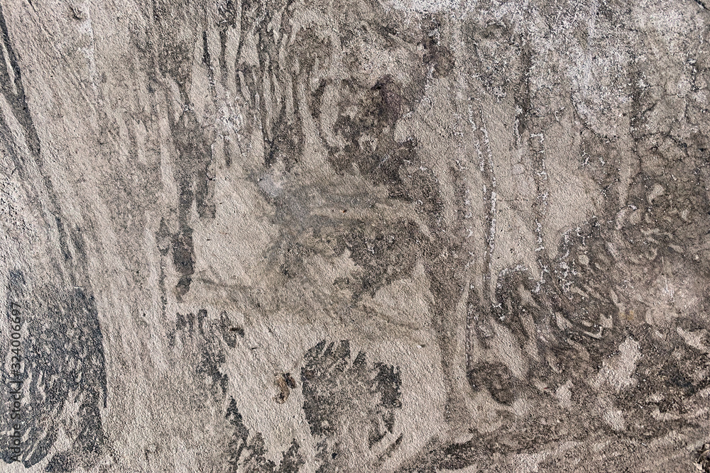 Naklejka premium Dirty, smooth, weathered grey concrete background with stains or splatters. Industrial, grunge, rustic or urban effect. 