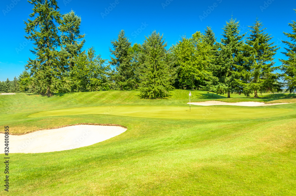 Golf course with gorgeous green and sand bunker Golf course with gorgeous green and sand bunker