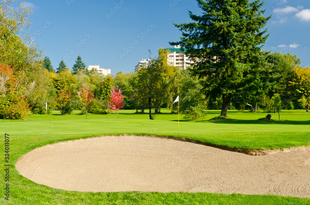 Golf place with gorgeous green and nice forest and urban view. Golf place with gorgeous green and nice forest and urban view.