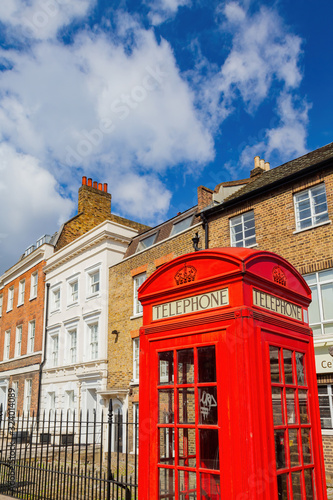 Red telephone booth on the street