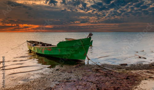 Coastal landscape with a small fishing boat that is still used for traditiona...