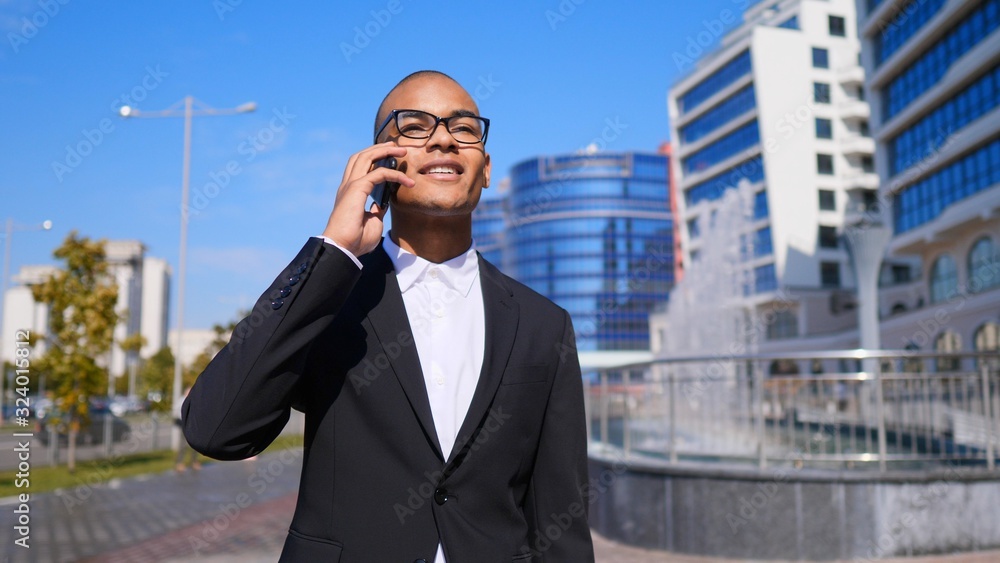 Handsome Businessman Making A Phone Call Near Office. Handsome Businessman Making A Phone Call Near Office.