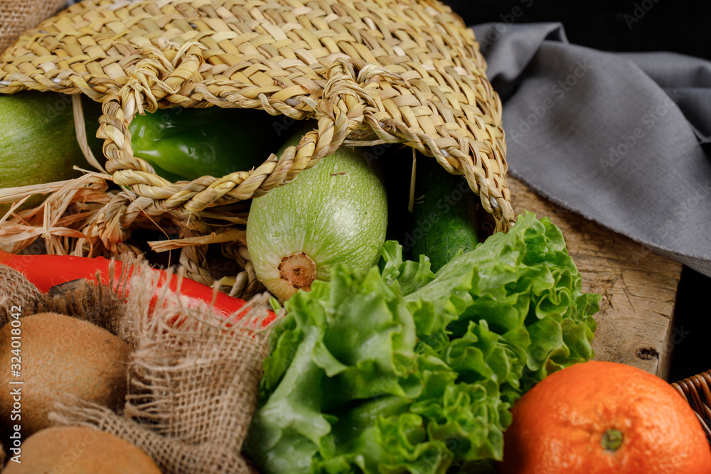 Vegetables and fruits in a rustic basket.