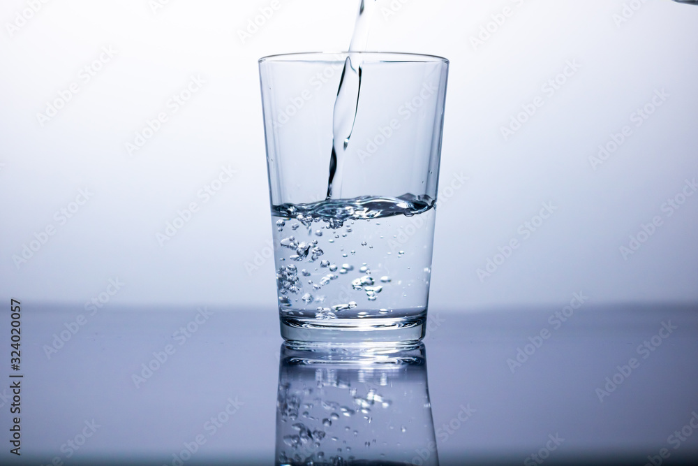 a glass fill with water and bubbles a glass fill with water and bubbles