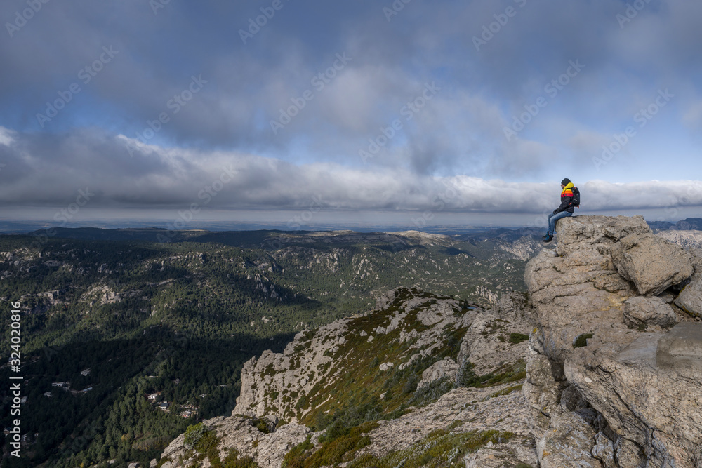 Men sitting above the clouds among the mountains Men sitting above the clouds among the mountains