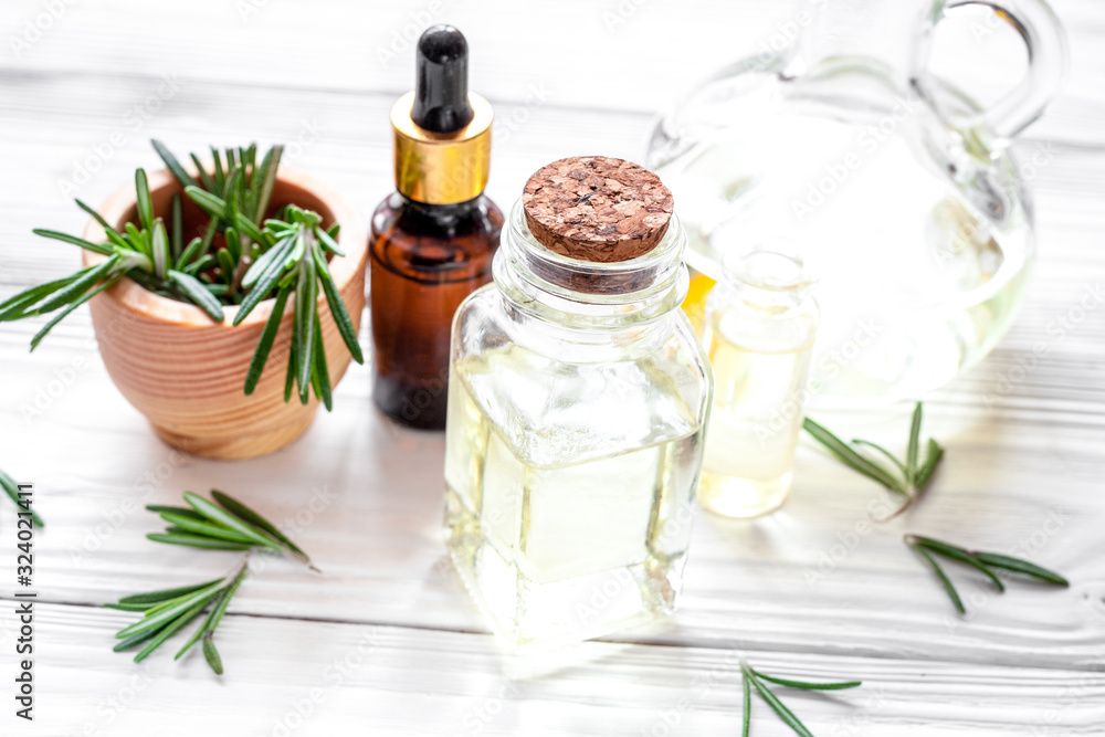organic cosmetics with extracts of herbs rosemary on wooden background organic cosmetics with extracts of herbs rosemary on wooden background