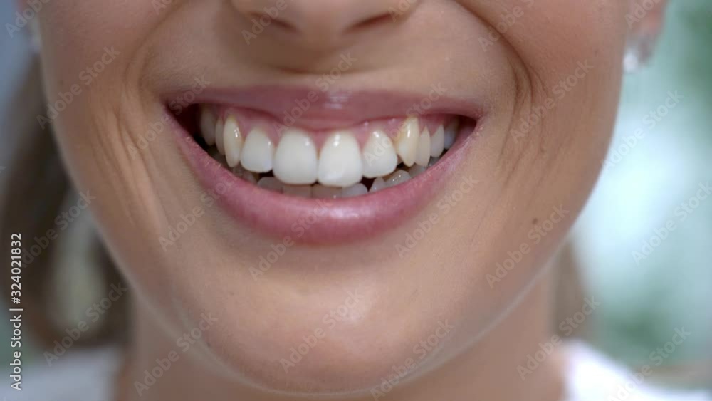 Happy confident adult woman smiling in bathroom in the morning Happy confident adult woman smiling in bathroom in the morning