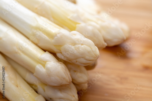 Fresh raw organic white asparagus vegetable ready to cook photo