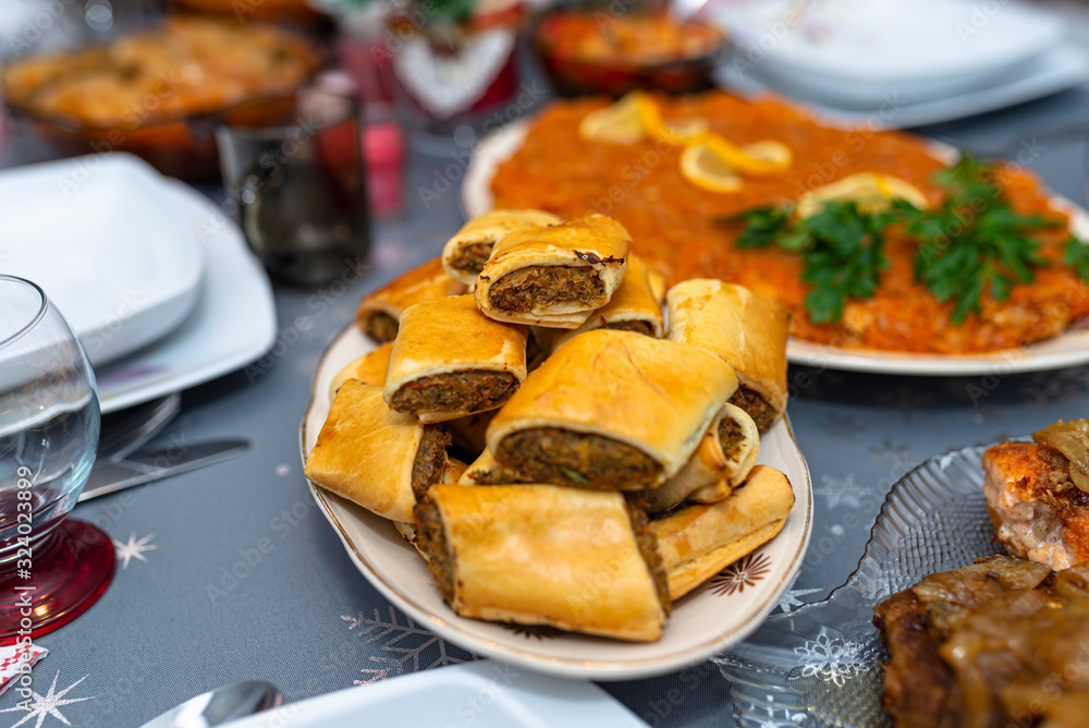 Baked pate in a pie lying on a holiday table on a plate. Baked pate in a pie lying on a holiday table on a plate.