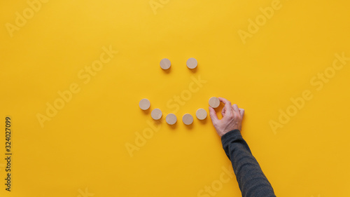 Konstfotografi Making a smiling face of blank wooden cut circles