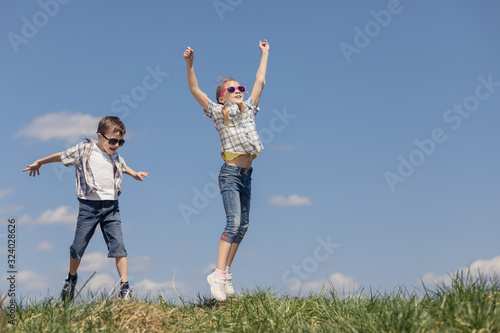 Brother and sister playing on the field