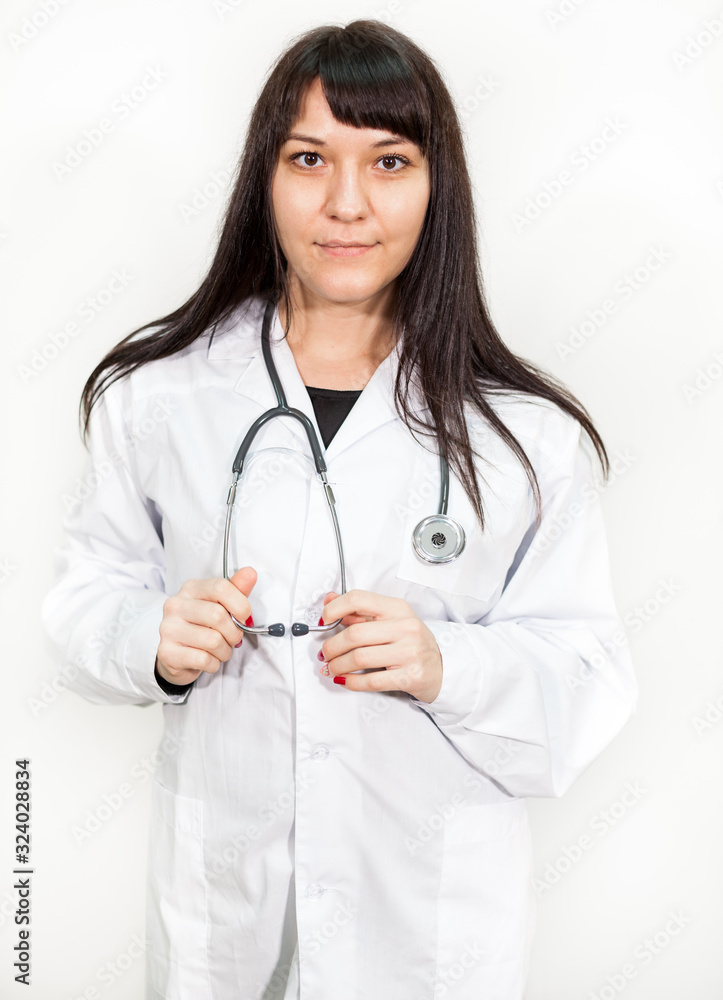 Portrait of young beautiful woman doctor or intern against white background Portrait of young beautiful woman doctor or intern against white background
