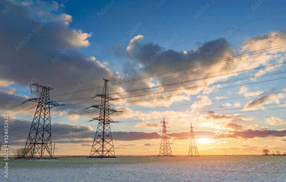 Power lines during a beautiful winter sunset. Power lines during a beautiful winter sunset.