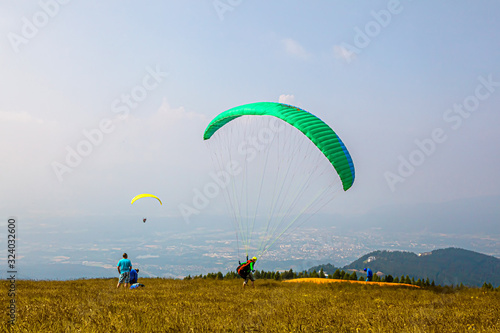 Paragliders ready to take off. Nice sunny day. The mountains . Austria.