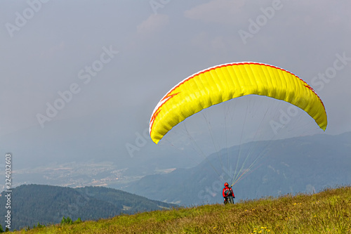 Paragliders ready to take off. Nice sunny day. The mountains . Austria.