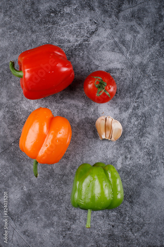 Color bell peppers on a blue background. Top view.