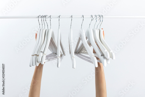 nothing to wear, woman holding empty hangers with her hands