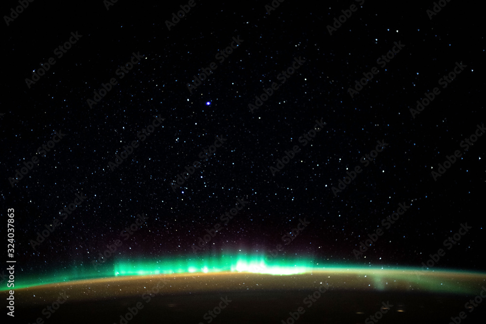 Aurora borealis aurora borealis over planet Earth on a background of the starry sky. Elements of this image furnished by NASA. Aurora borealis aurora borealis over planet Earth on a background of the starry sky. Elements of this image furnished by NASA.