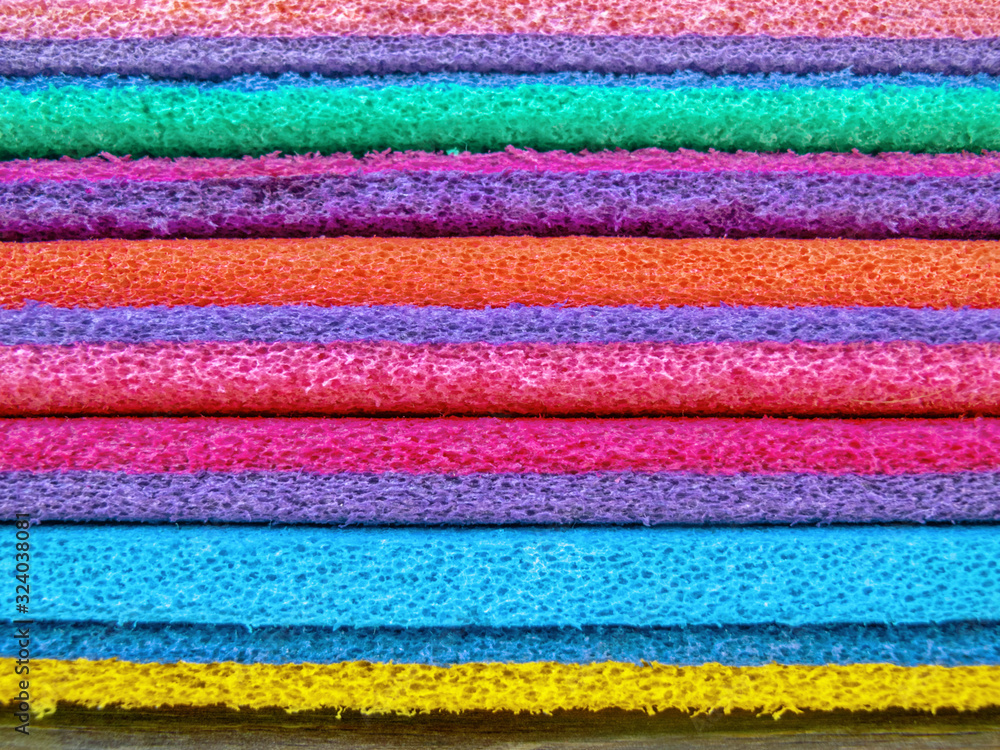 Obraz premium bright colorful sports mats stacked, close up, film effect