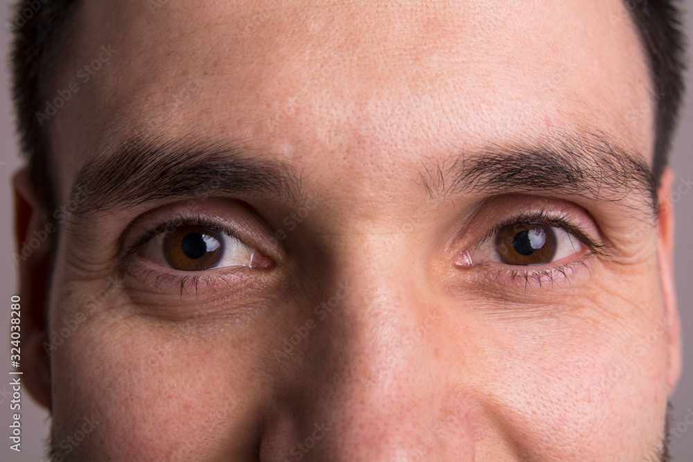 Obraz premium Portrait of a happy handsome young man. Close-up of the gaze