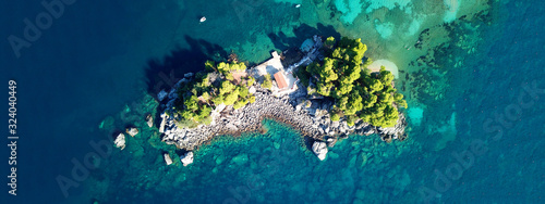 Aerial drone of paradise small islet with landmark chapel of Panagia in picturesque village of Parga, Ionian, Greece