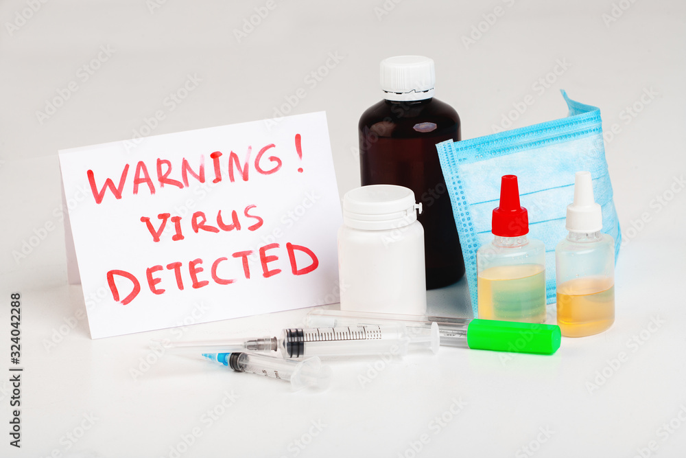 Various medications, pills, syringes, medical mask, text VIRUS DETECTED on white background. Various medications, pills, syringes, medical mask, text VIRUS DETECTED on white background.
