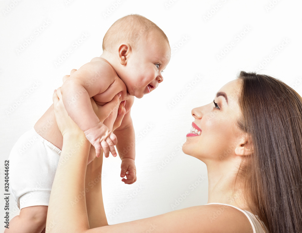 Mother and baby playing and smiling. Happy family. Mother and baby playing and smiling. Happy family.