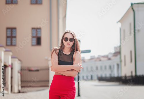 Fashion portrait of young pretty woman posing in Europe 