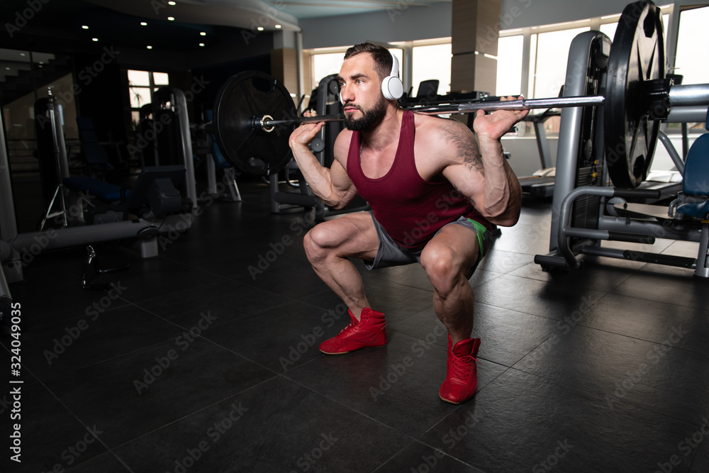 Man Doing Heavy Weight Exercise With Barbell