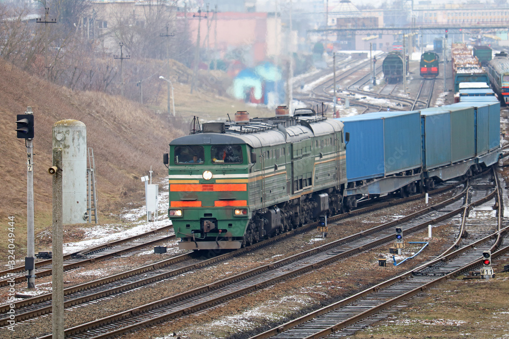 freight locomotive passes the railway station freight locomotive passes the railway station