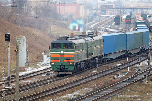 freight locomotive passes the railway station