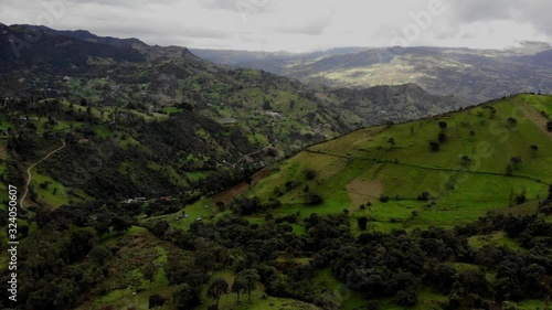 Flight over fields in mountains, aerial drone shot in Colombia, magical