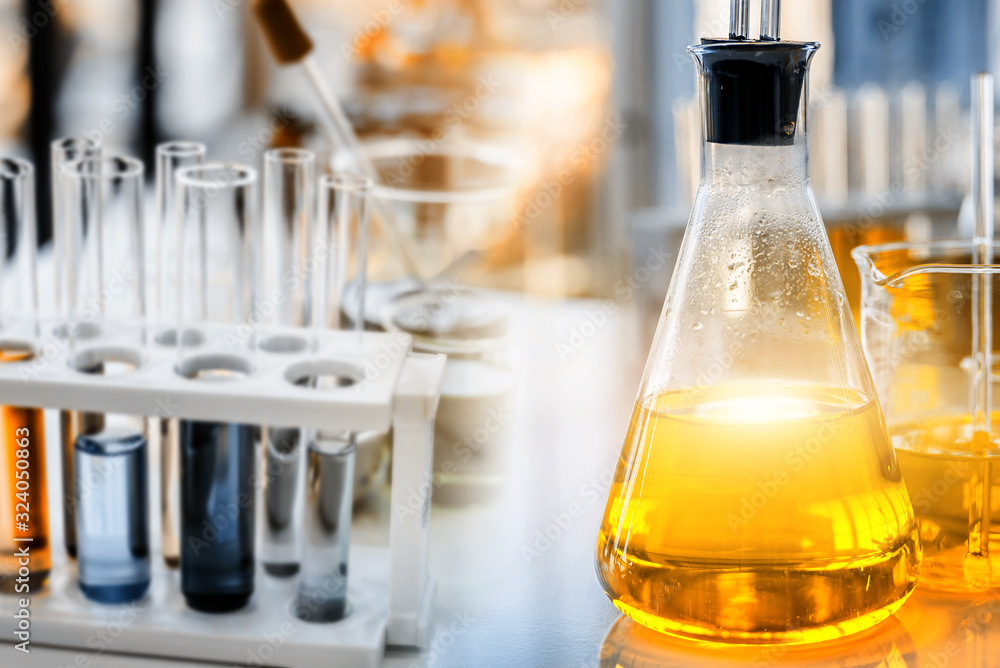 flask containing chemical liquid with test tube and lab glassware in chemical laboratory background, science laboratory research and development concept flask containing chemical liquid with test tube and lab glassware in chemical laboratory background, science laboratory research and development concept
