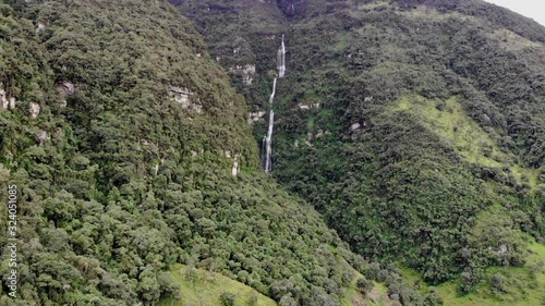 mountain waterfall, aerial drone shot in Colombia, magical, La chorrera Waterfall