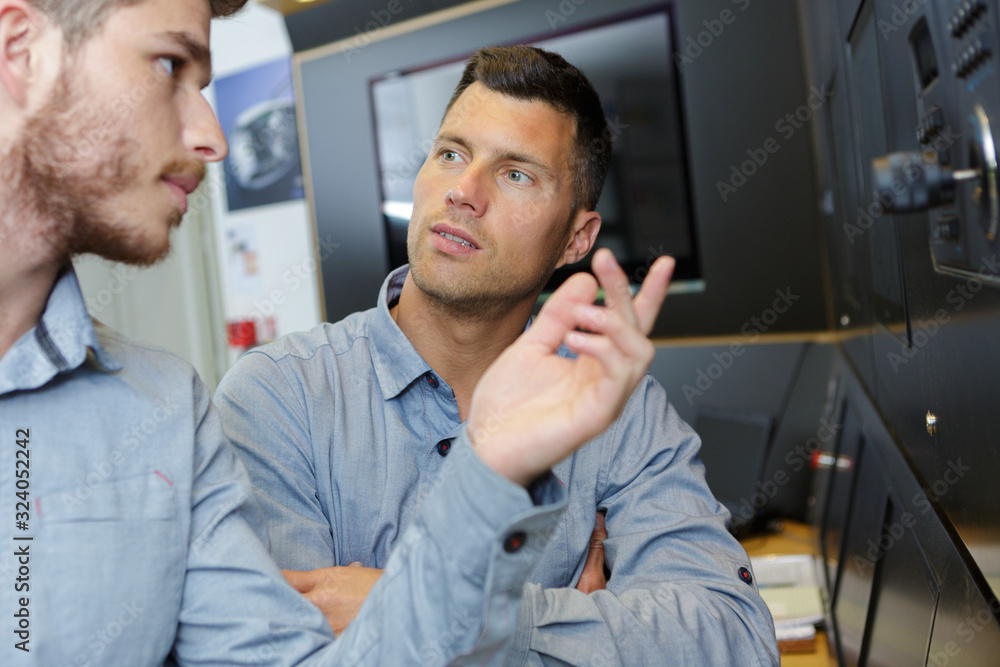 factory manager and engineering apprentice talking factory manager and engineering apprentice talking