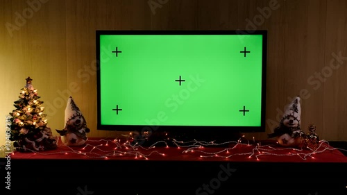 Christmas TV with green screen composited. TV or television - green screen - room - on the table. Christmas time