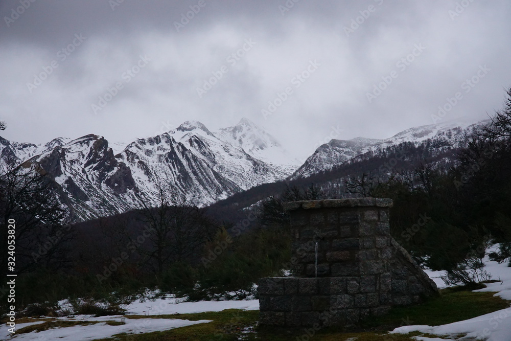 spring with snowy mountains in the north of spain, picos de europa