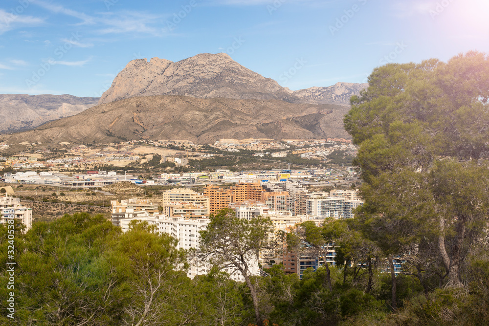Natural park and residential complex on the background of Mount Puig Campana in La Cala de Fenistrat, Benidorm, Spain