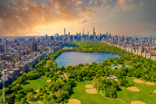 Aerial view of Manhattan New York looking south up Central Park during epic sunset over the city.