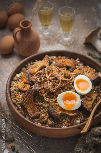 Buckwheat pilaf with mushrooms, onion and eggs