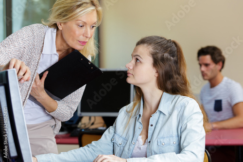 young woman using computer in classroom