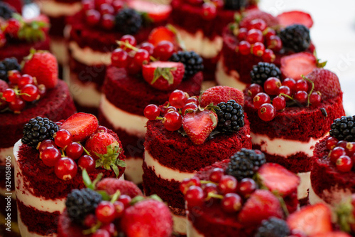 Red velvet mini cakes with blackberry close up