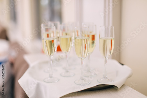 champagne glasses on white tape © Ivan